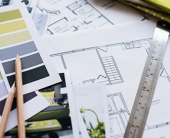 Architectural plans for building openings on a drafting table.