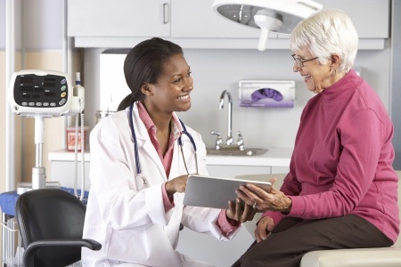 Doctor reviewing results with patient on examination table