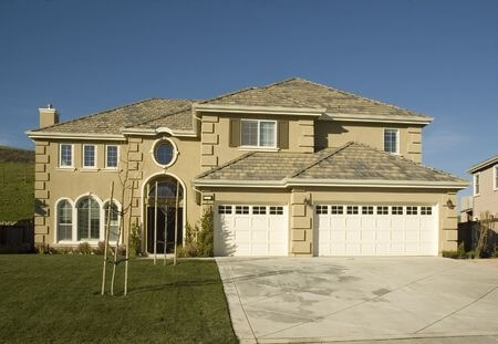 modern stone home with large entranceway