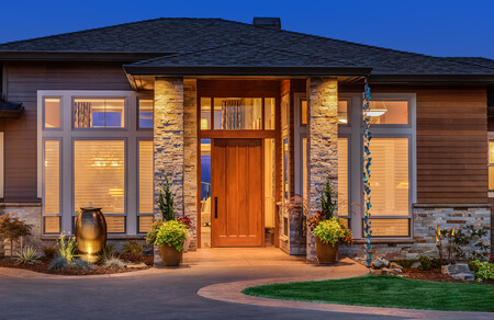 front elevation of luxury home in evening